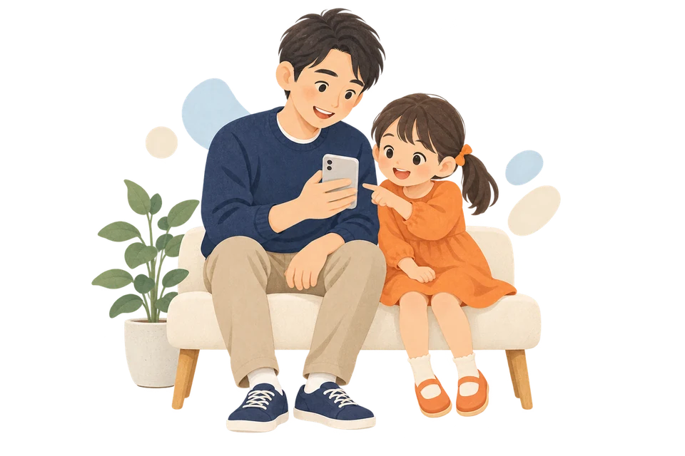 ソファでスマートフォンを見ながら過ごすパパと娘